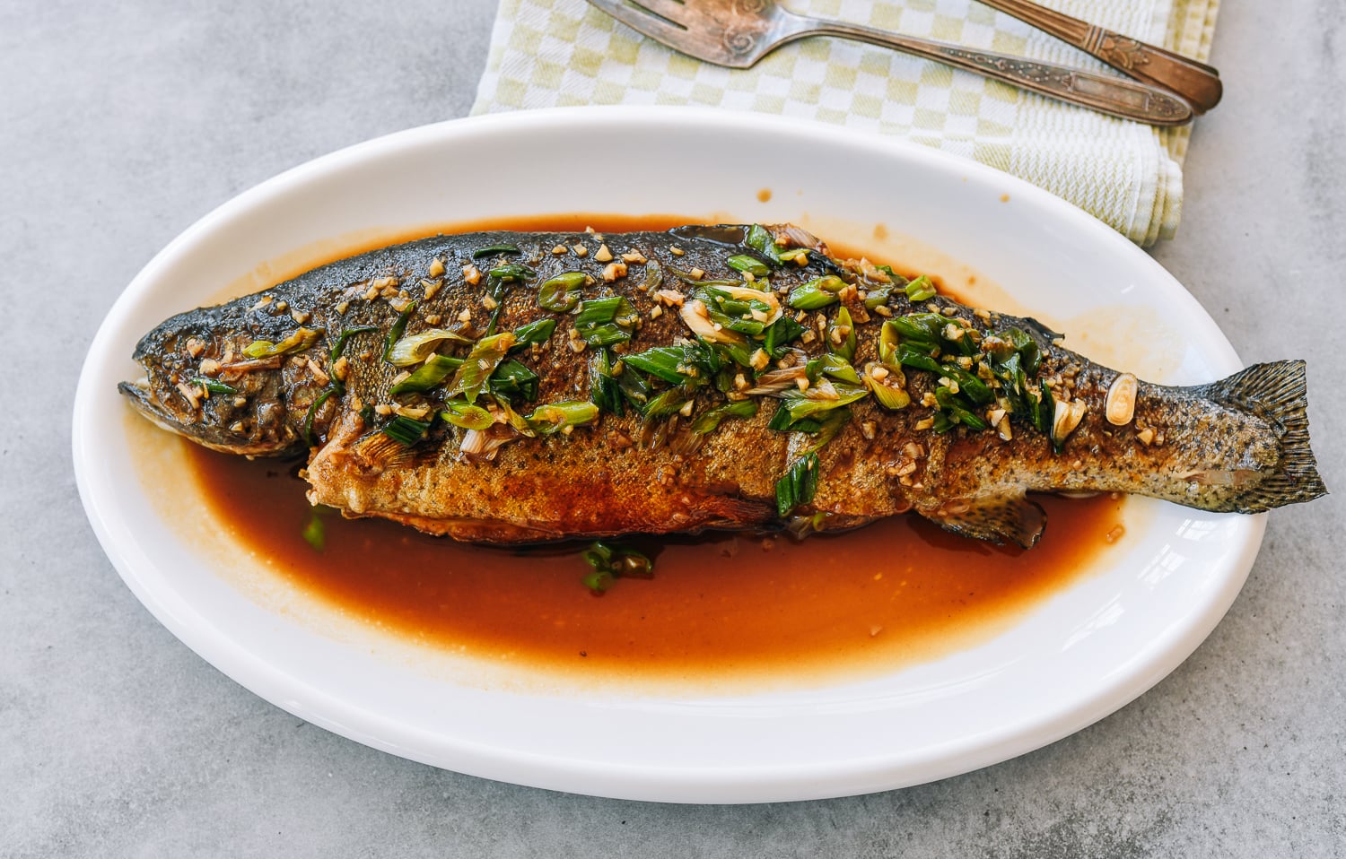 Whole trout with soy garlic butter and scallions