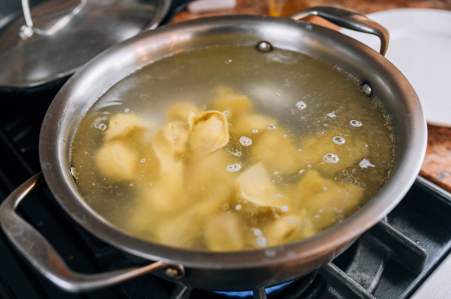 cooking wontons in pot of water