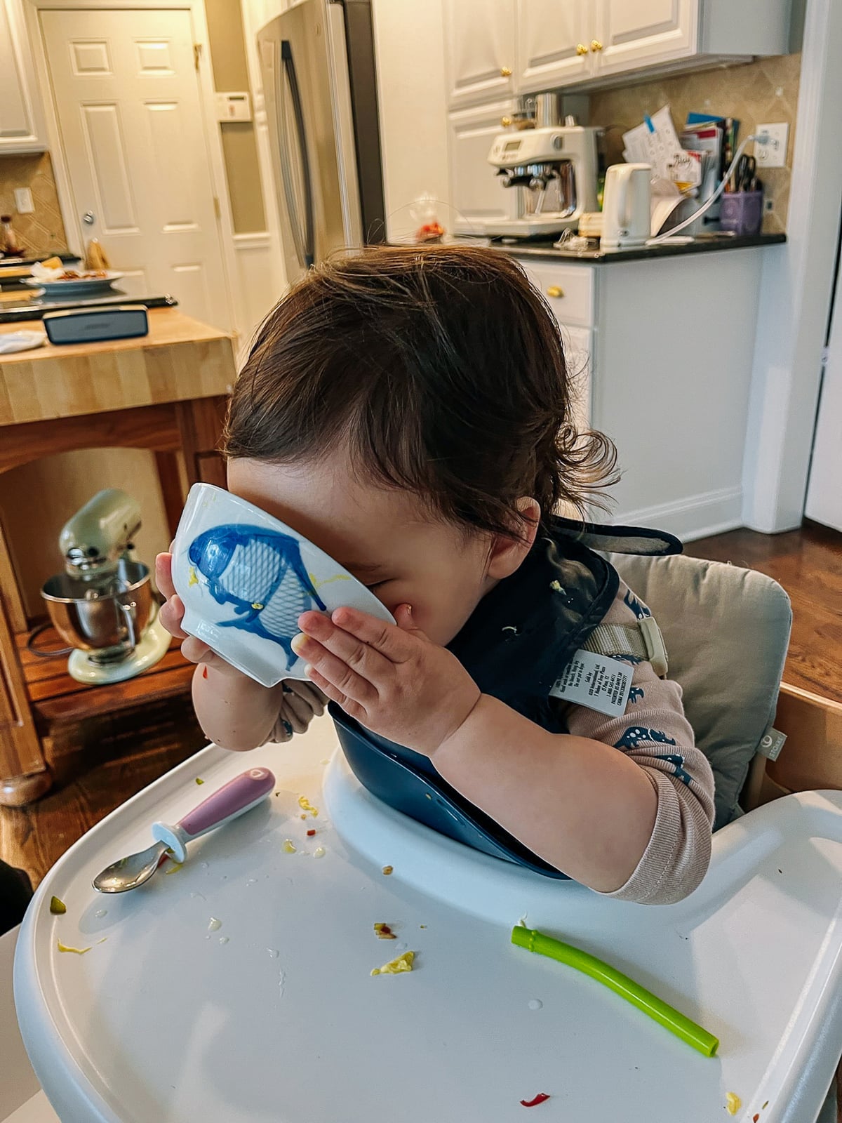 Ethan drinking bowl of soup