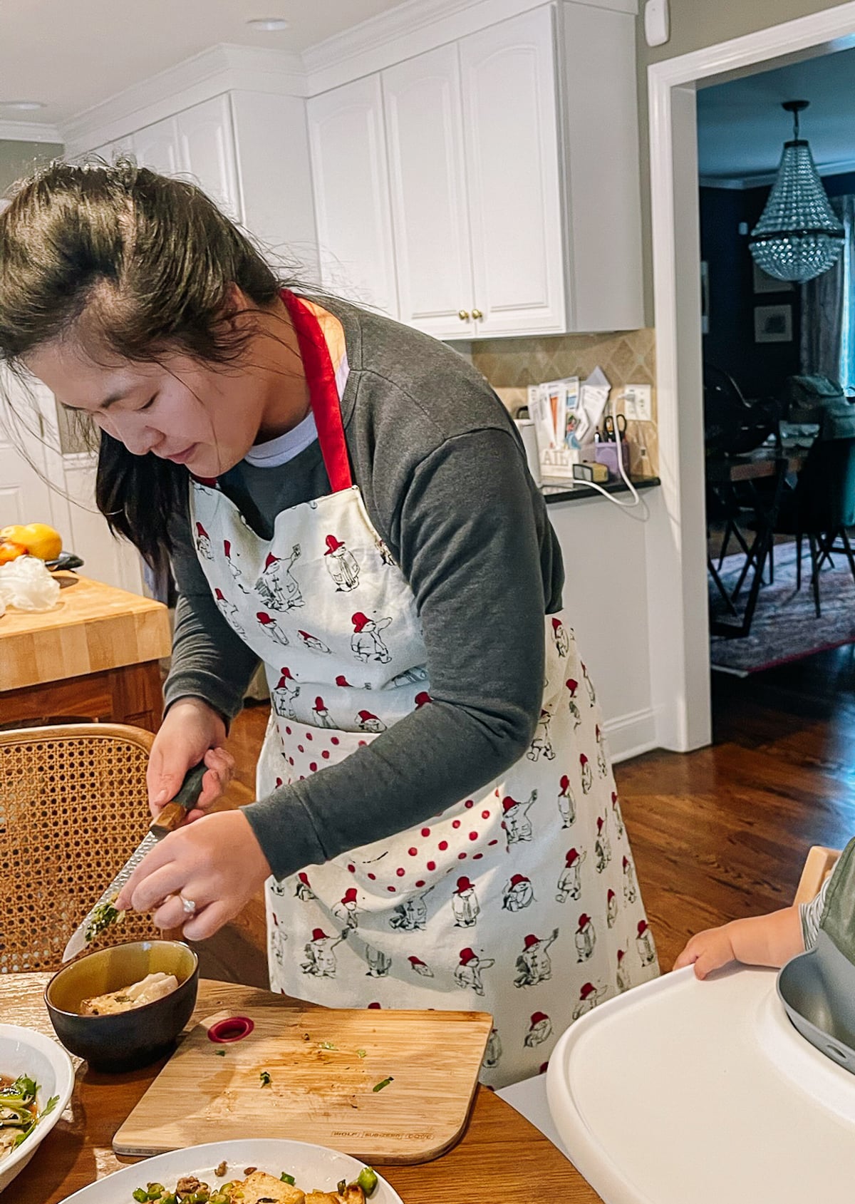 Sarah chopping up food for Ethan