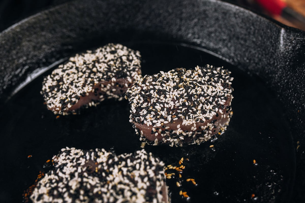 sesame crusted tuna steaks in cast iron skillet