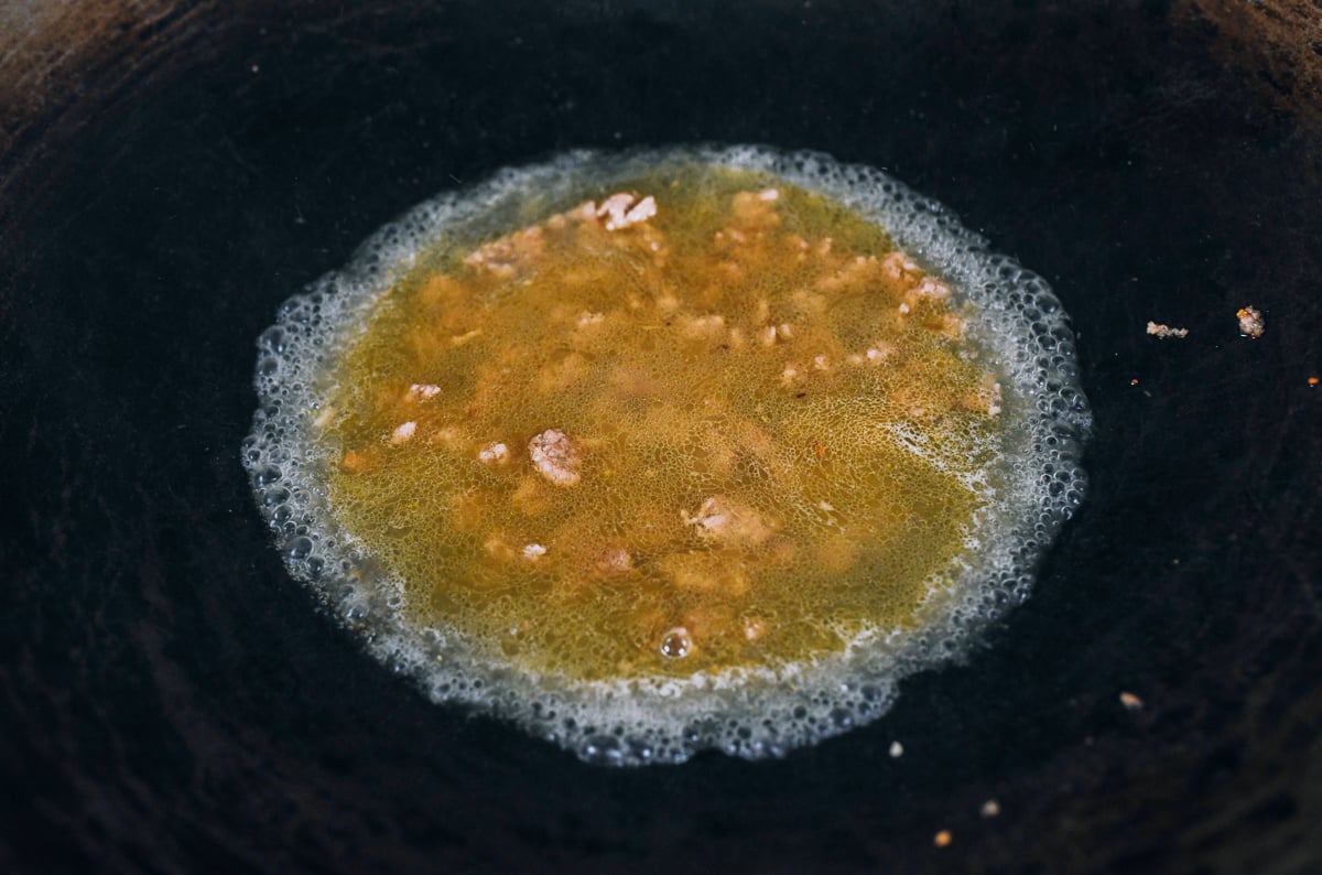 sauce mixture added to ground pork in wok