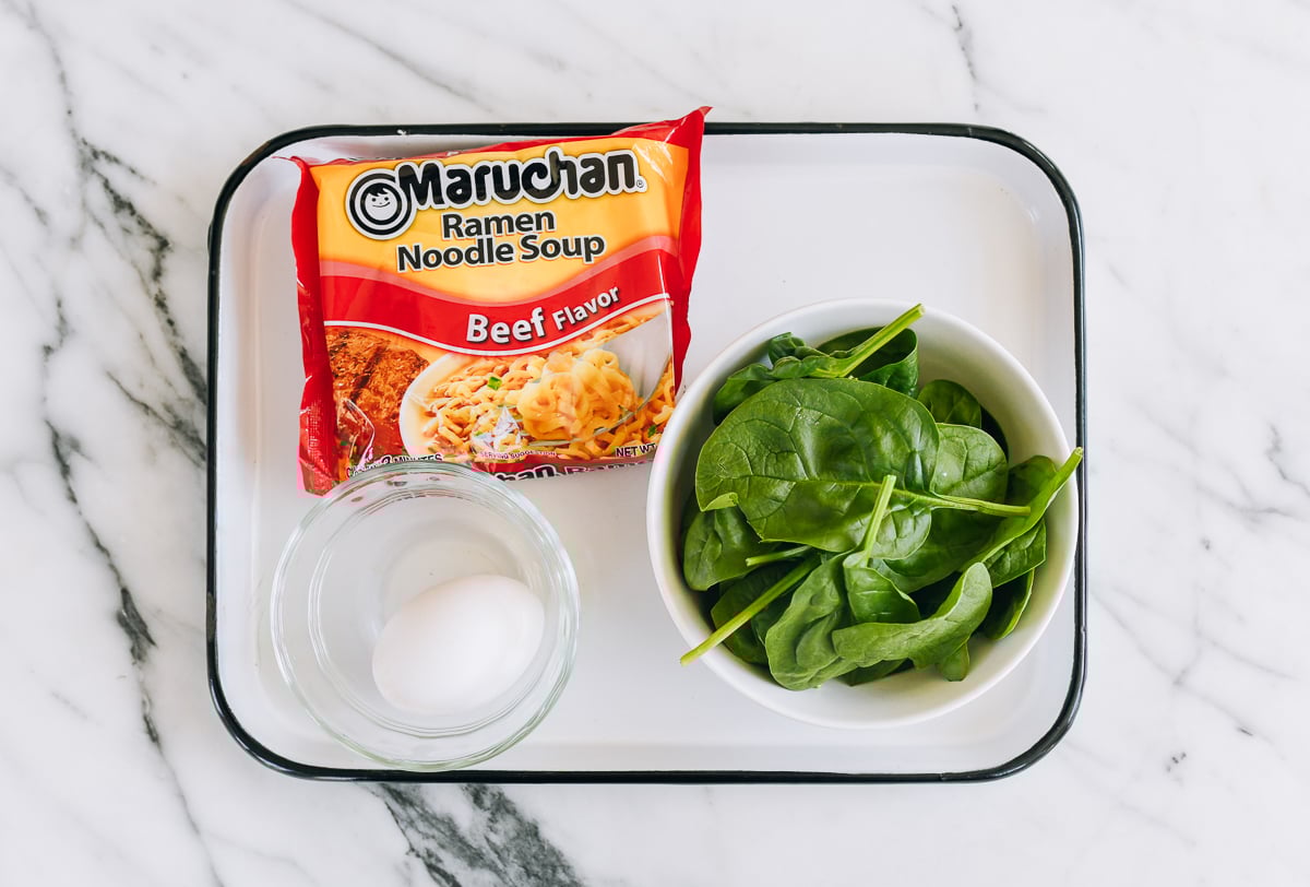 beef instant noodle packet, egg, and spinach