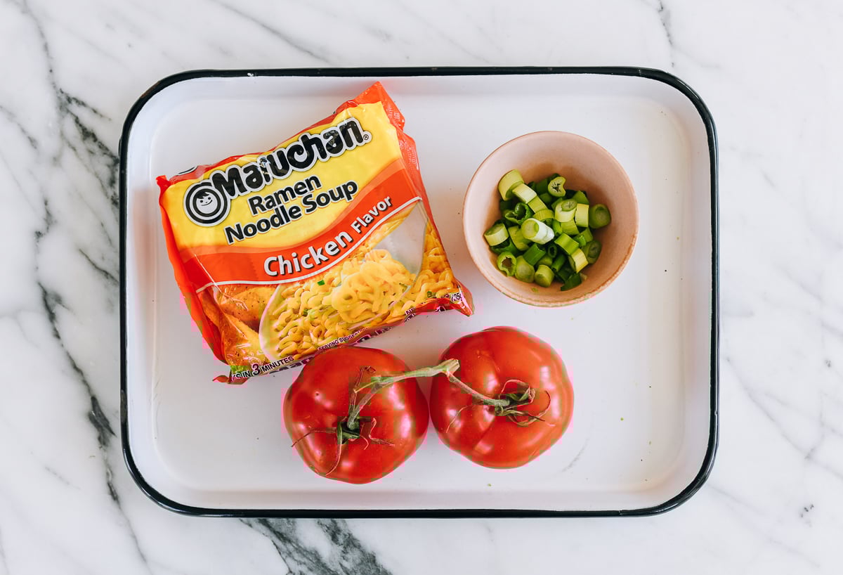 chicken instant noodle packet, tomato, and scallions