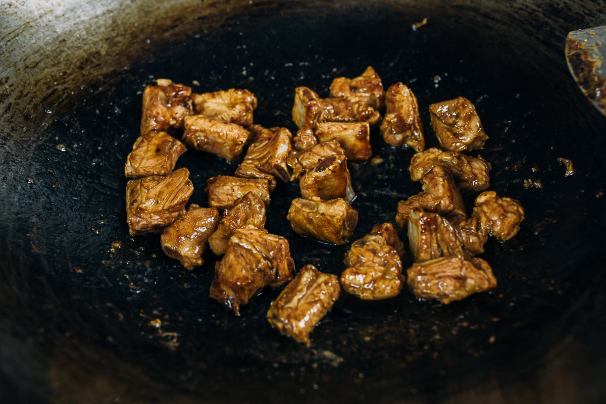 cooking small rib pieces in wok