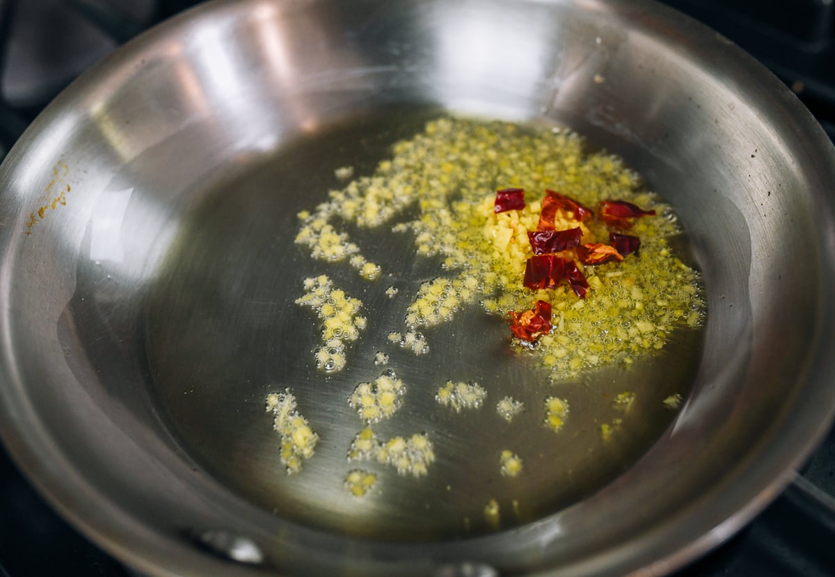 ginger and chilies cooking in pan