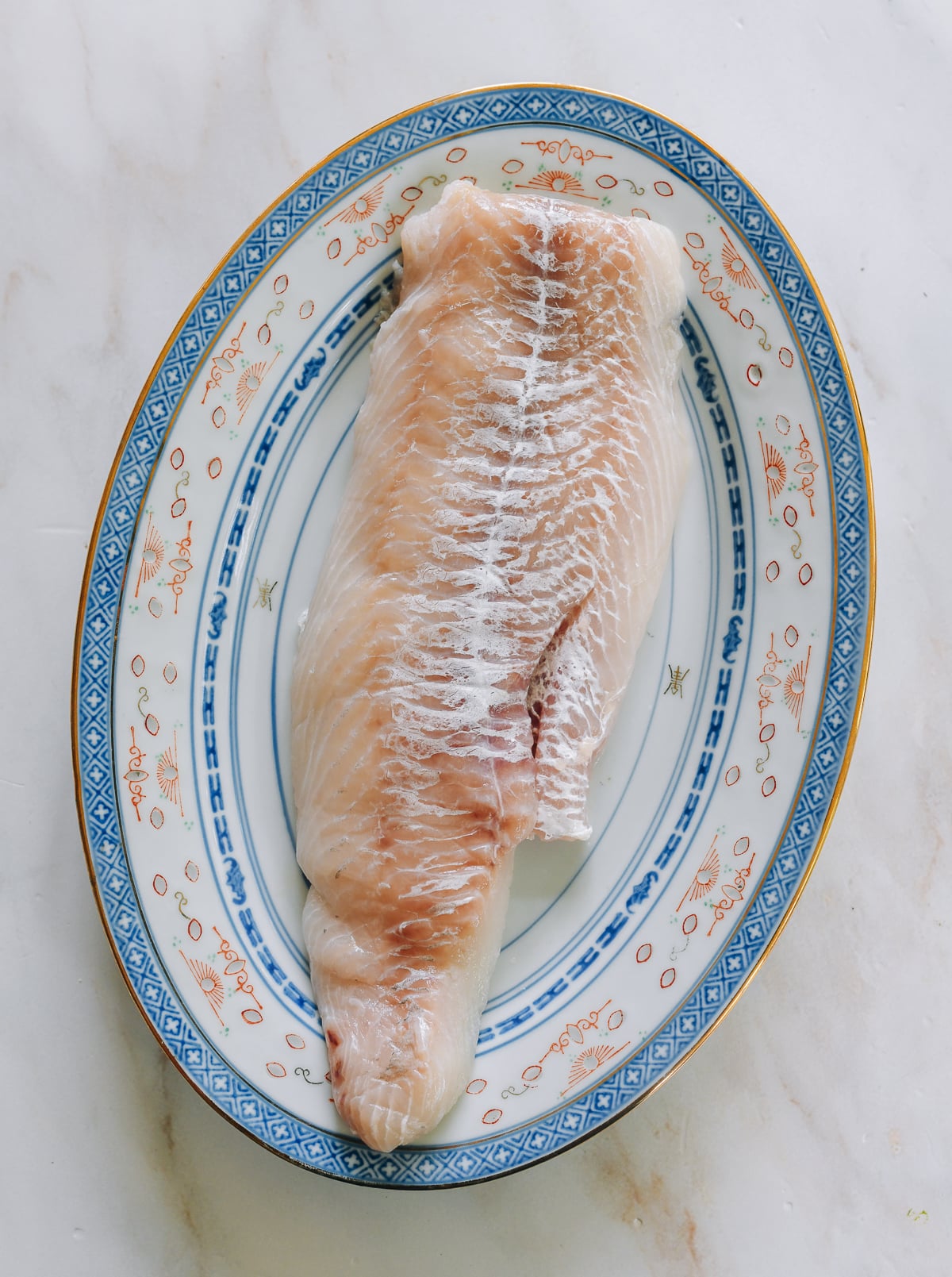 cod fillet on heatproof Chinese plate for steaming