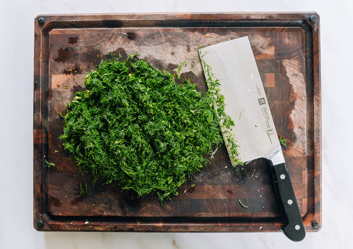 chopped dill on cutting board