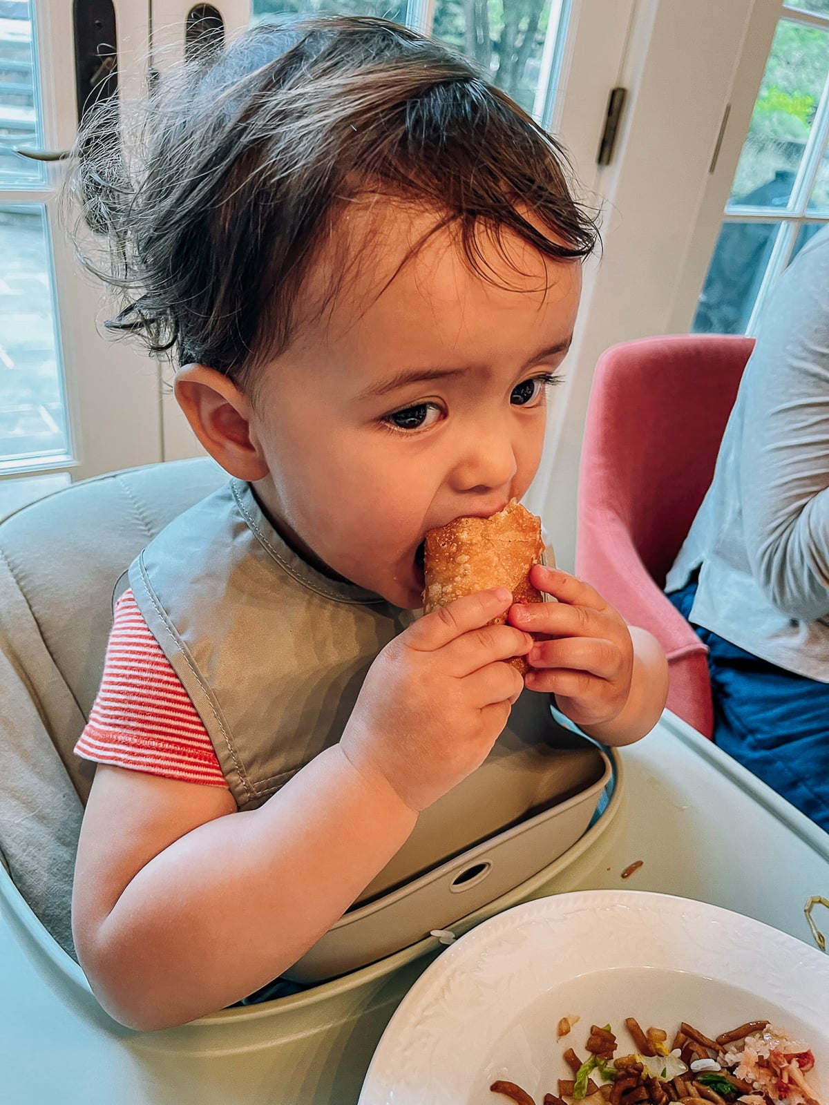 Ethan eating an egg roll