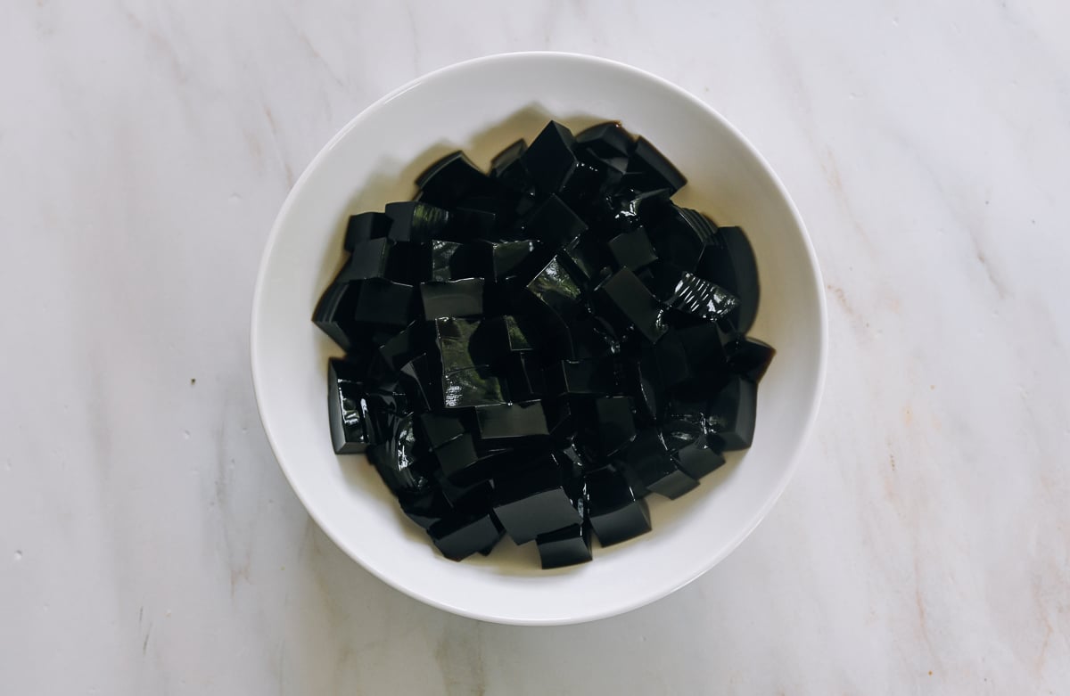 diced grass jelly in white bowl
