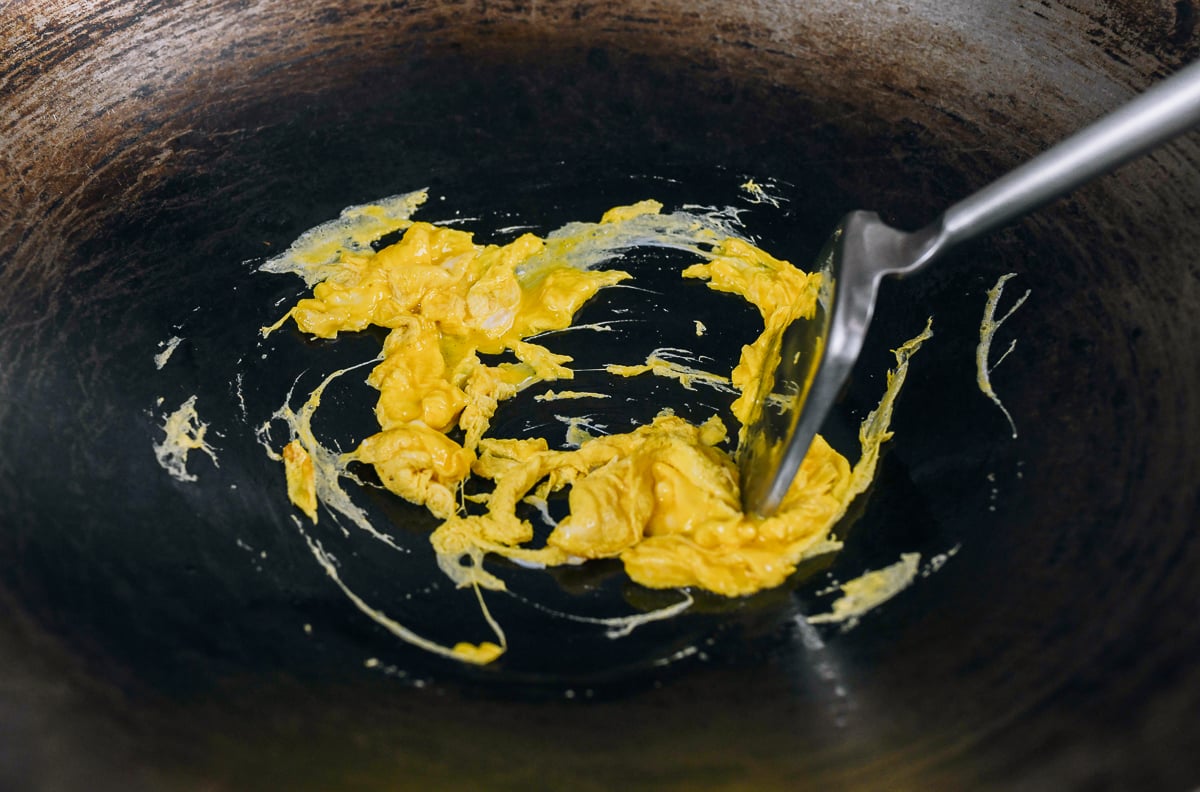 scrambling eggs in a wok