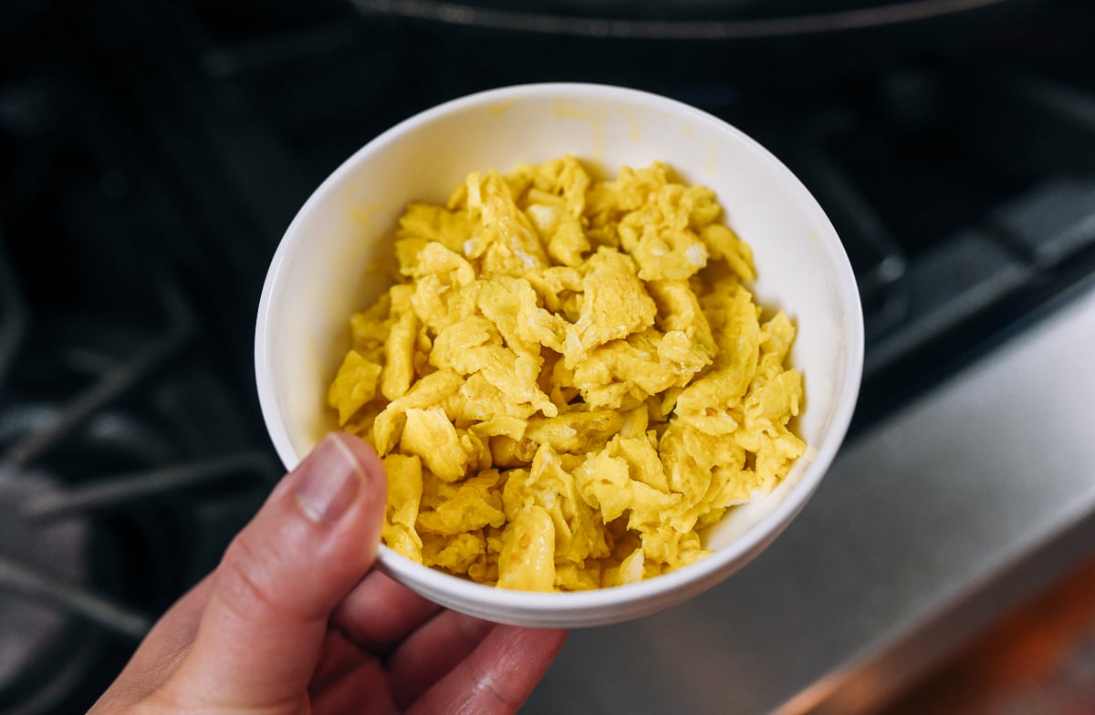 bowl of scrambled eggs broken up into small pieces