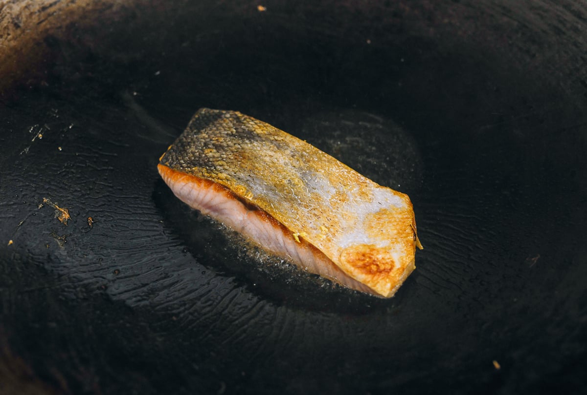 searing salmon in wok