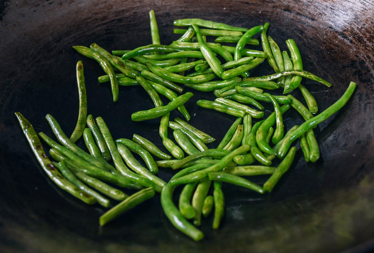 blistered string beans in wok