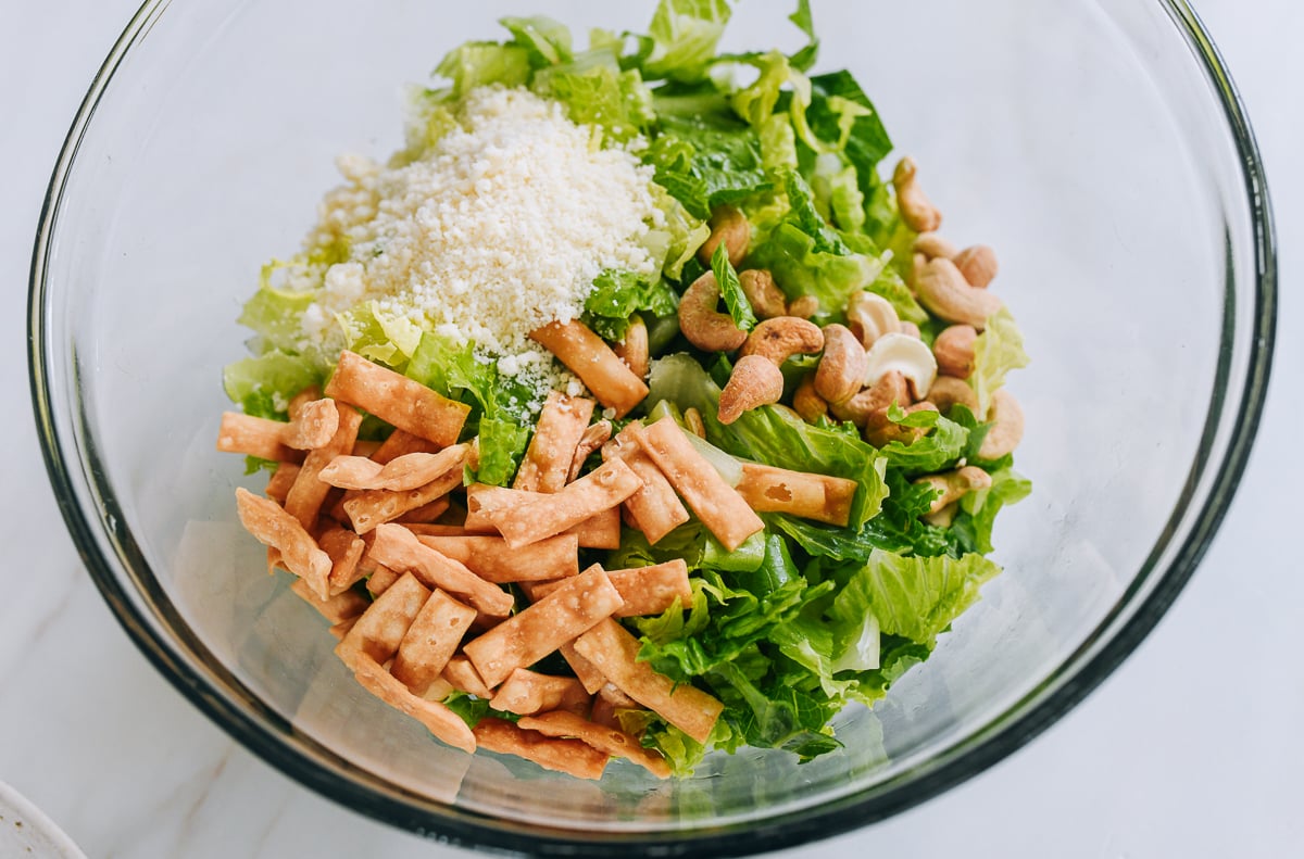 miso caesar salad ingredients in bowl