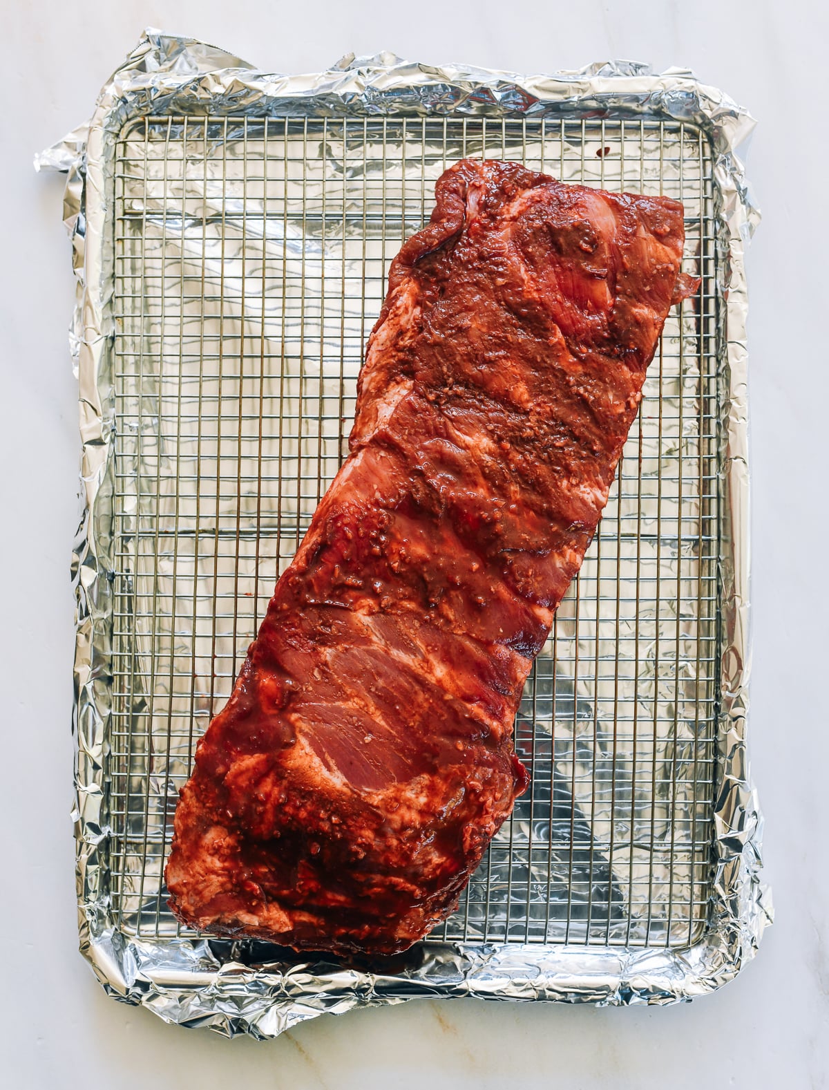 marinated ribs on rack