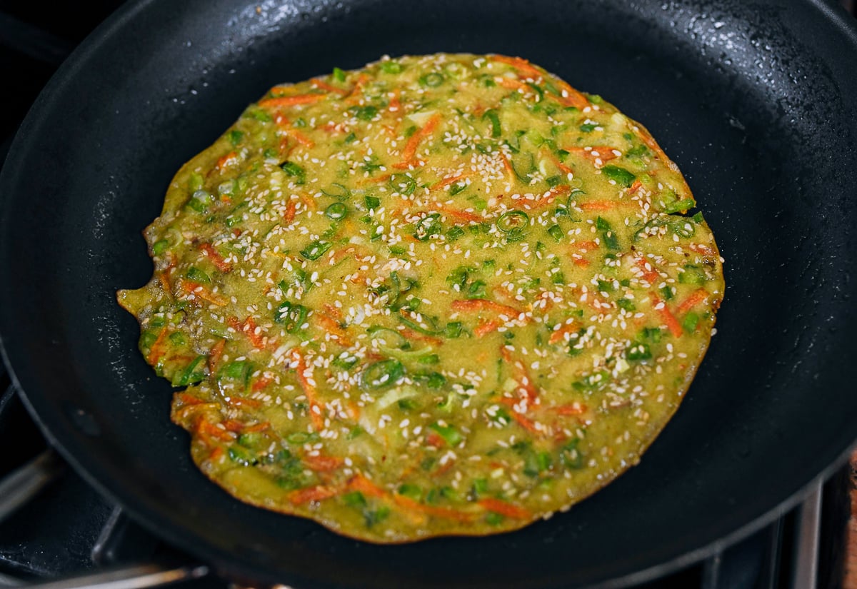 vegetable pancake before flipping