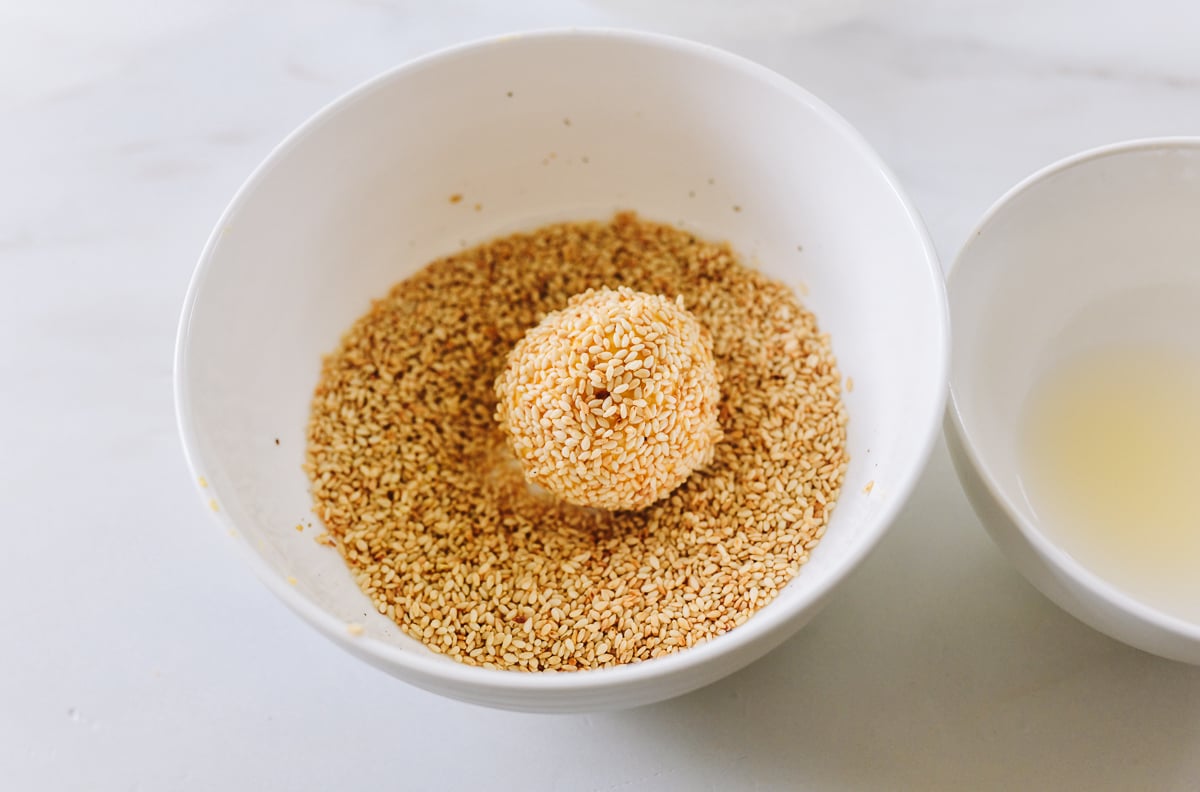 dough ball rolled in toasted sesame seeds
