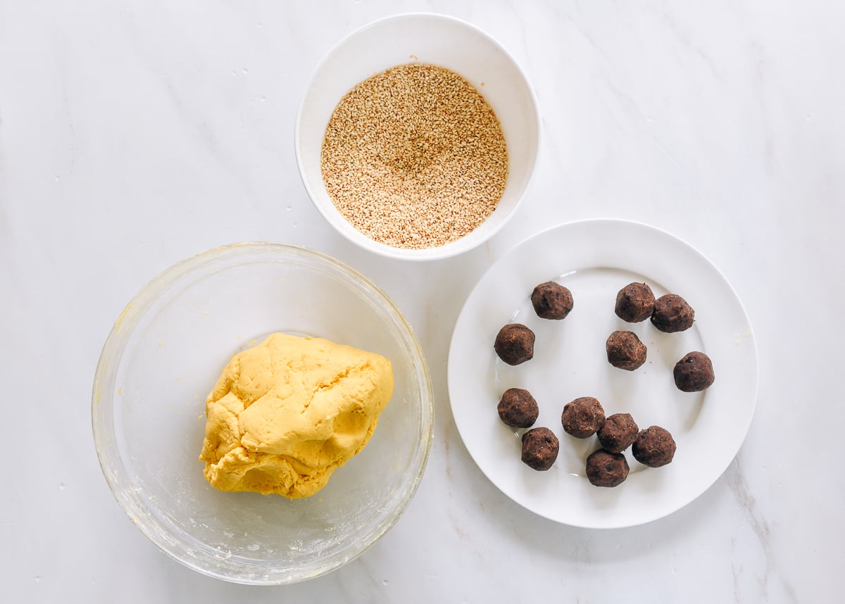 nan gua bing dough, filling, and bowl of sesame seeds