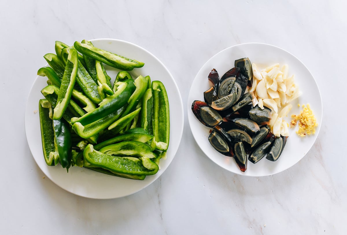 prepared peppers, century eggs, garlic, and ginger