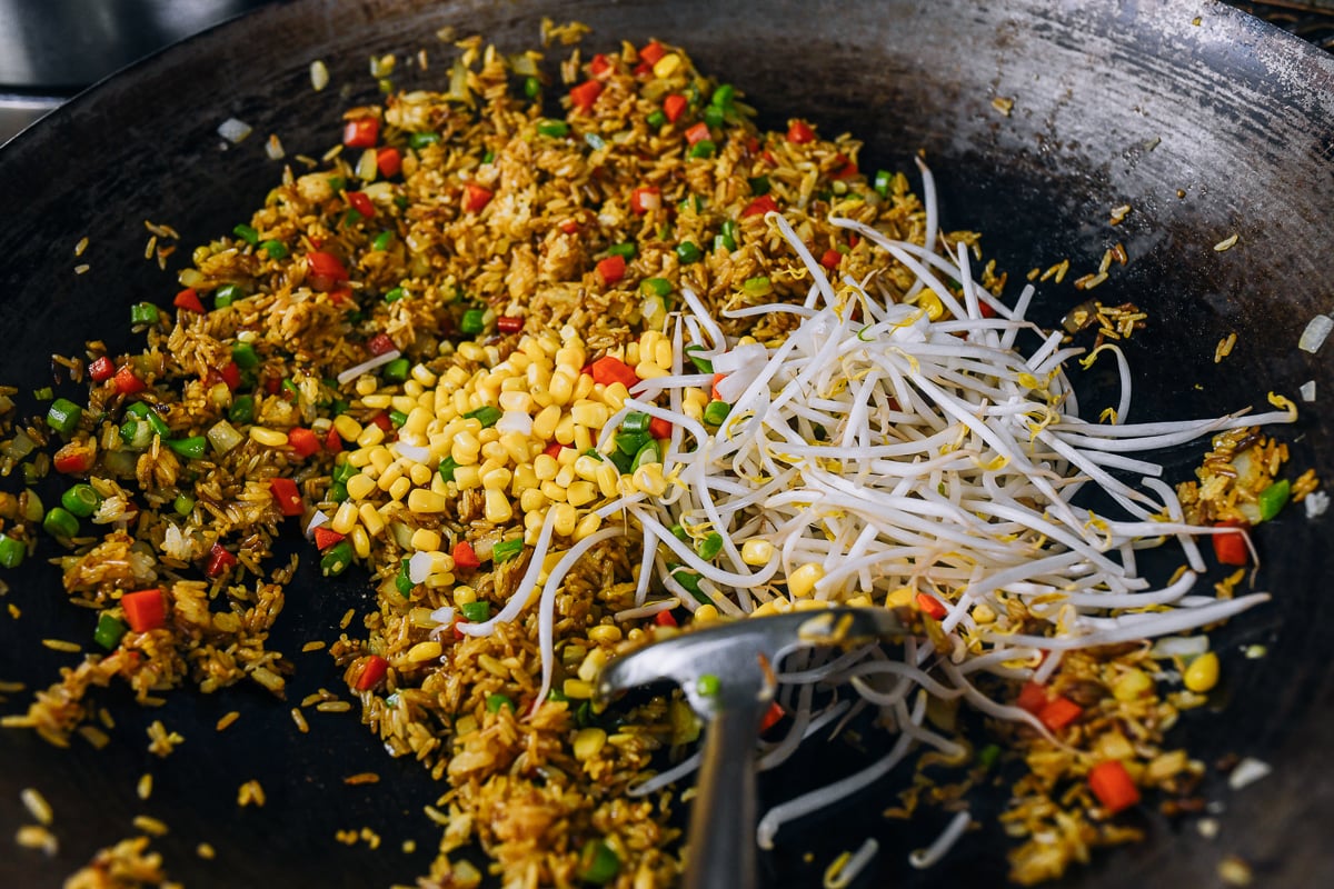 bean sprouts and corn added to fried rice