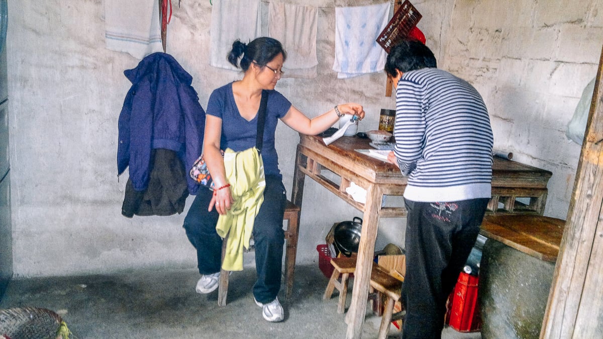 judy talking with the proprietor to order lunch