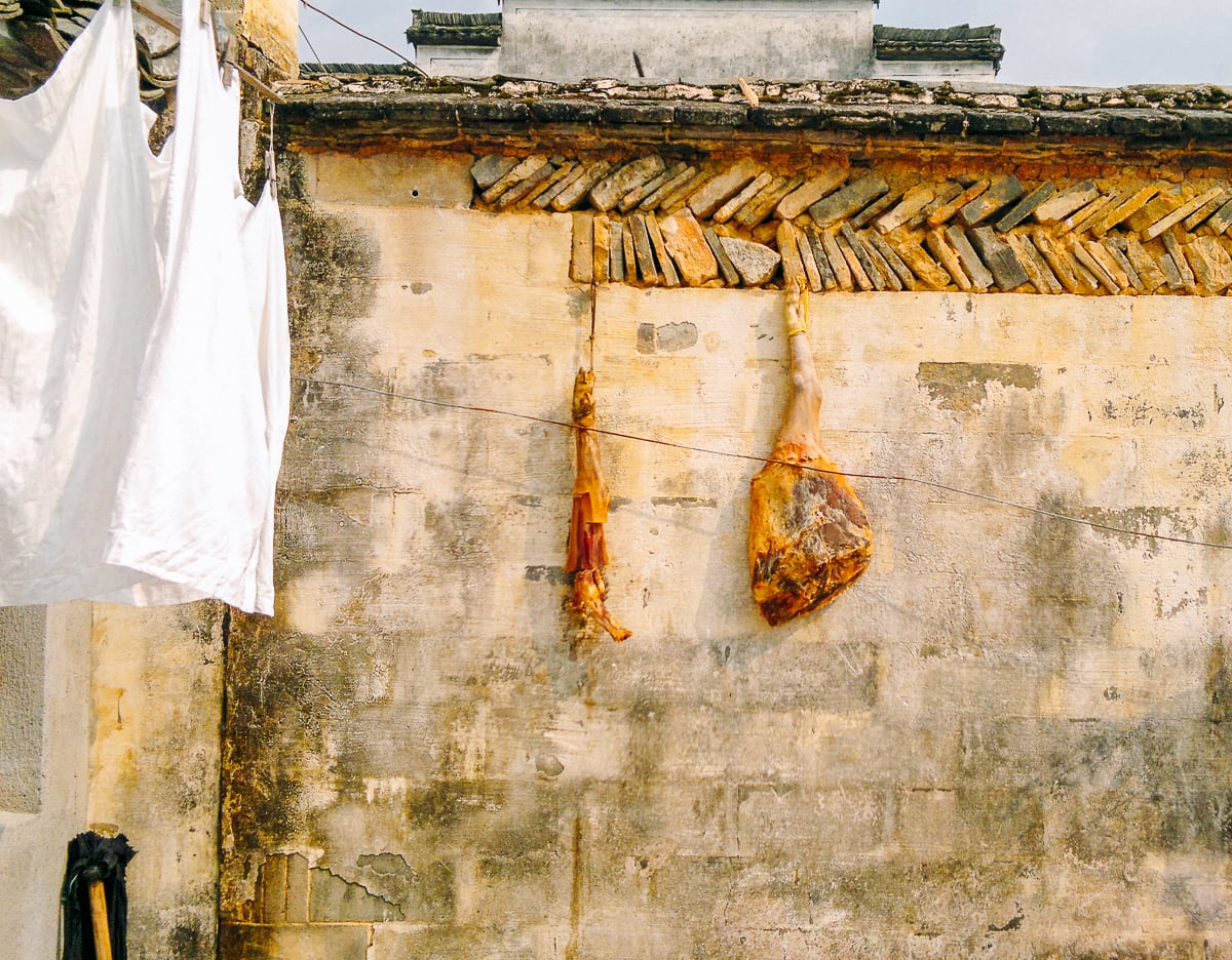cured ham hanging in chinese courtyard