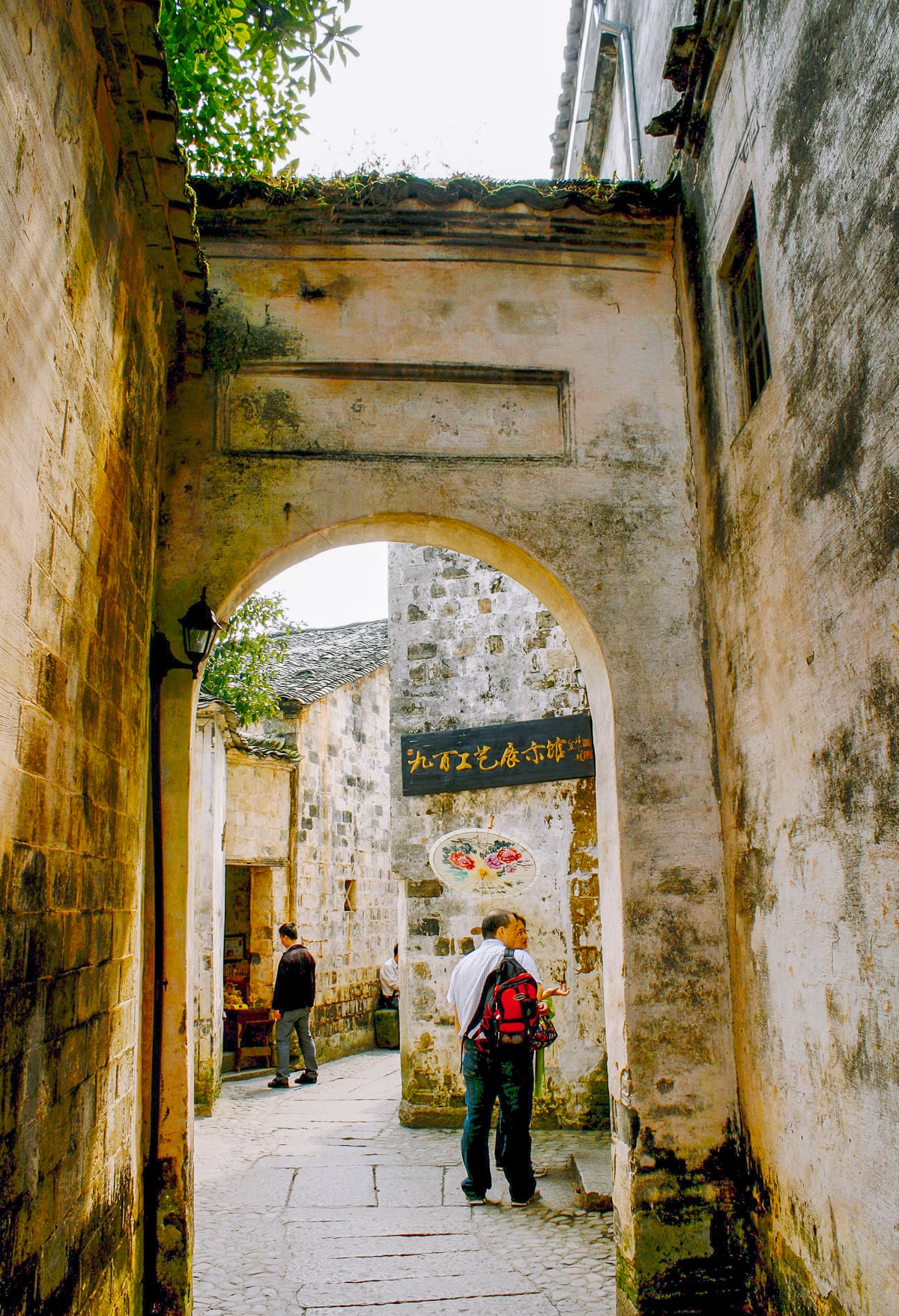 bill and judy walking through hongcun village