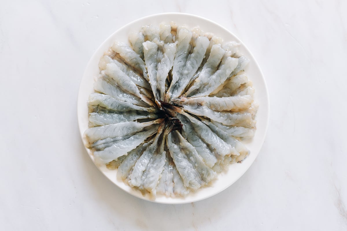 butterflied raw shrimp on plate