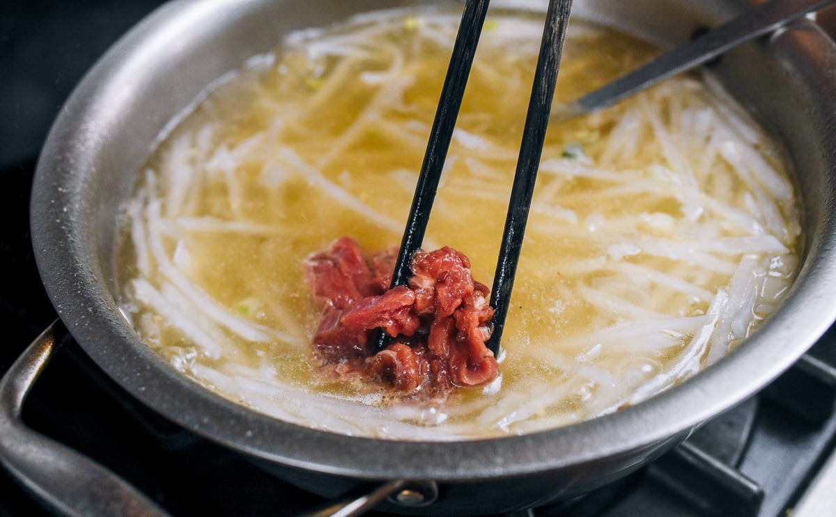 adding beef to soup