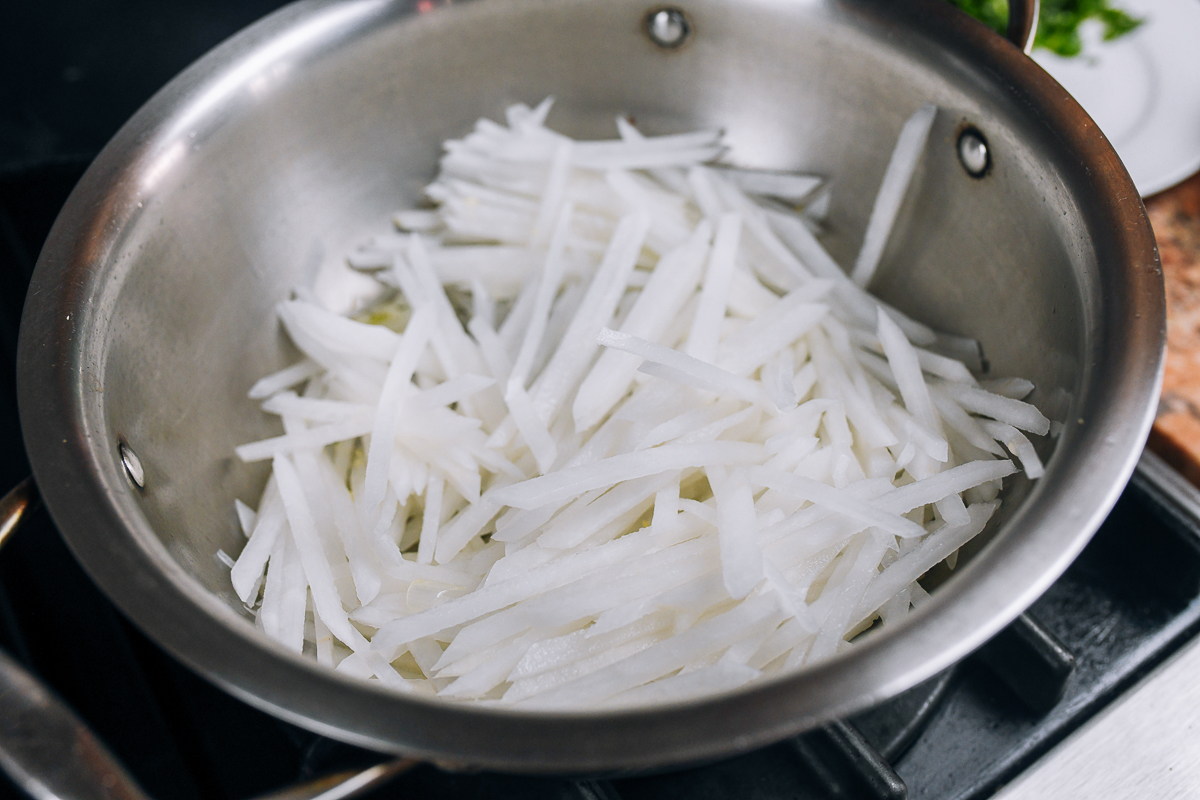 julienned daikon radish in soup pot