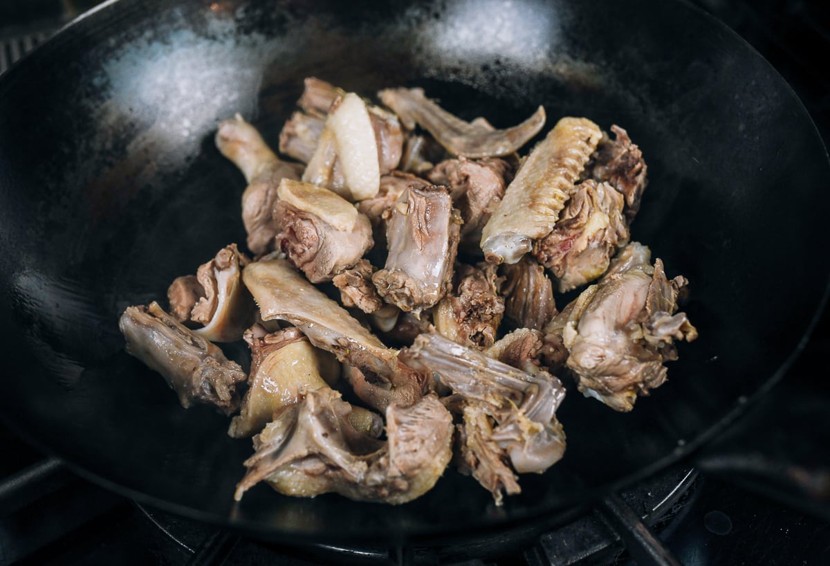 blanched duck pieces in wok