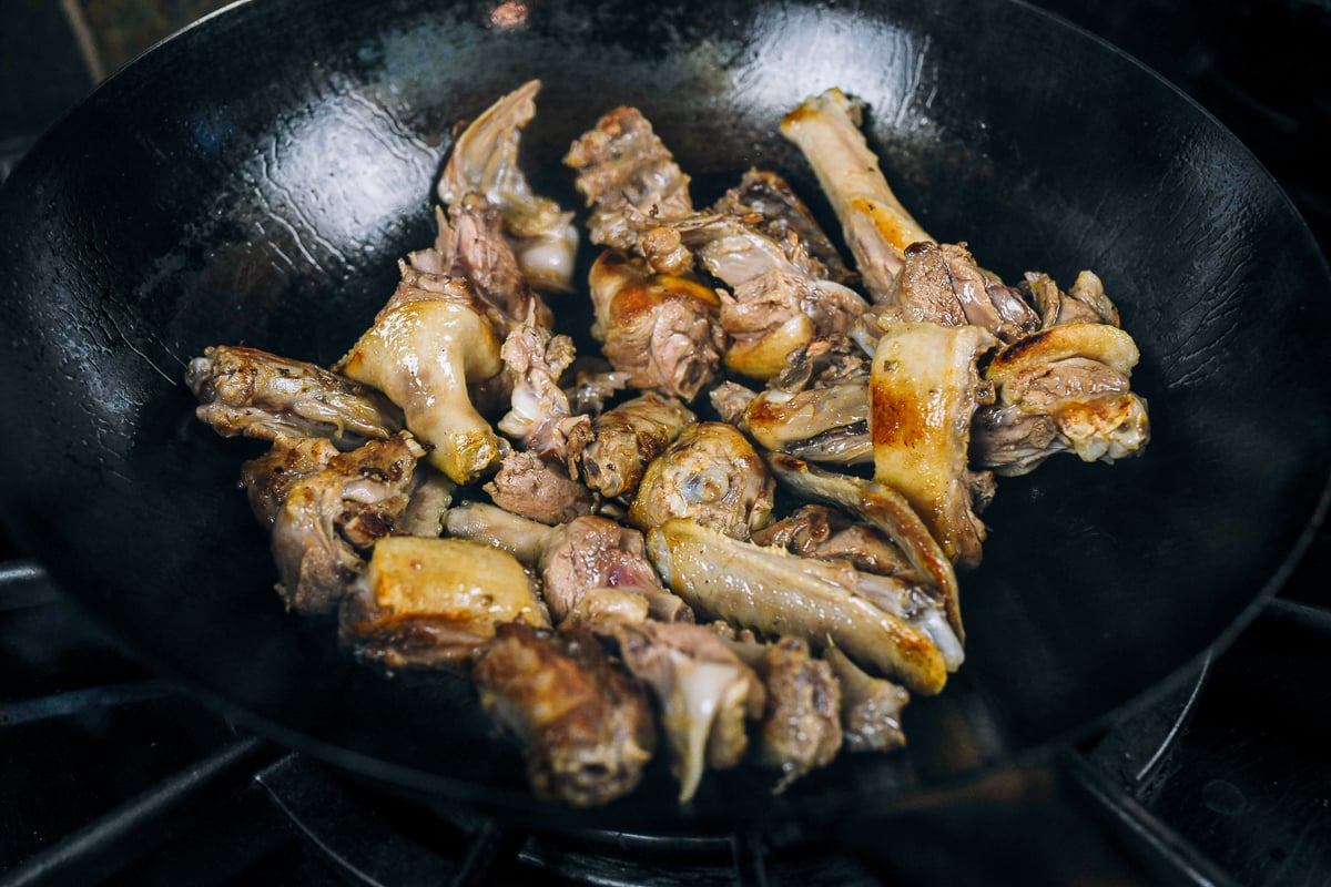 browning duck pieces in wok