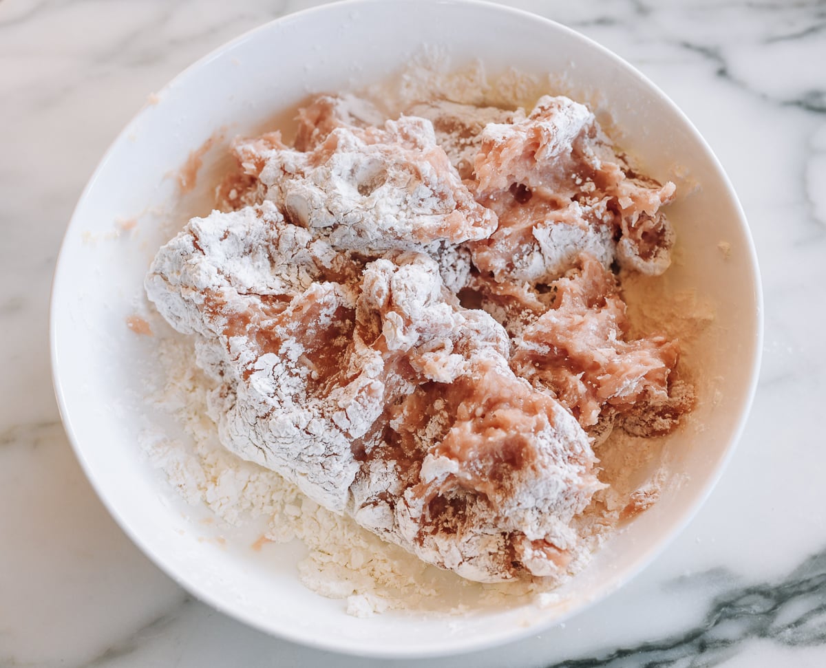 ground chicken tossed in cornstarch flour mixture