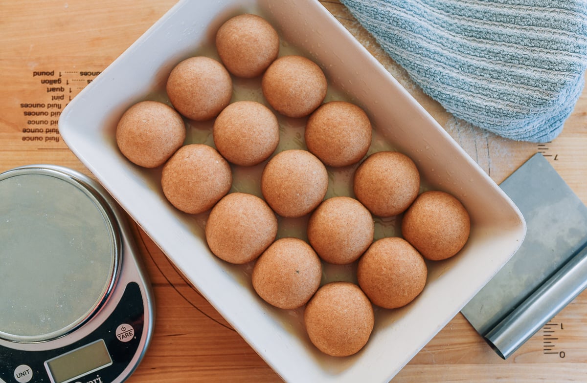 balls of dough in baking dish