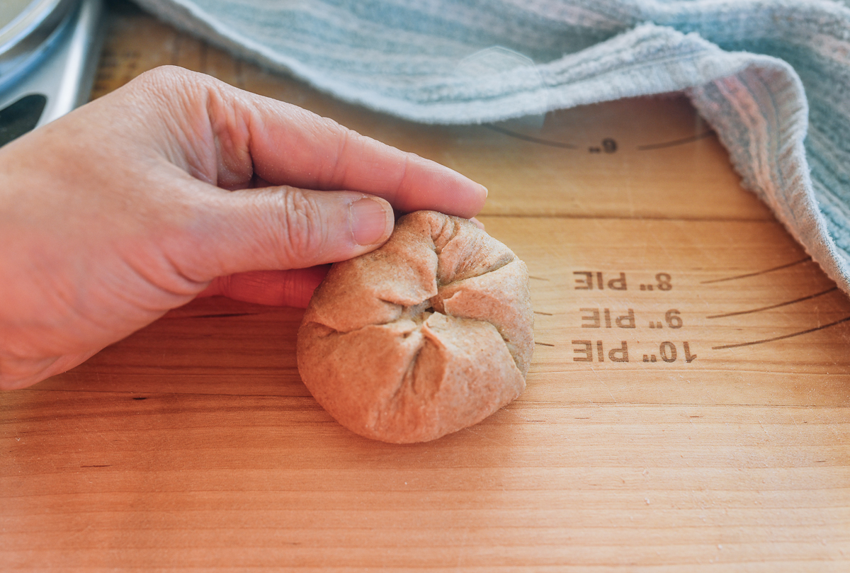 making dinner roll dough balls