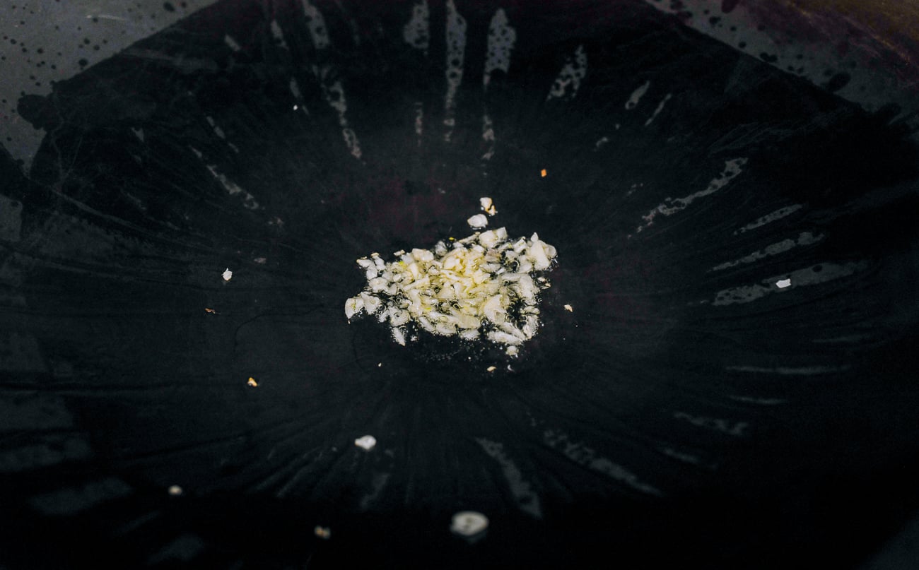 cooking chopped garlic in oil