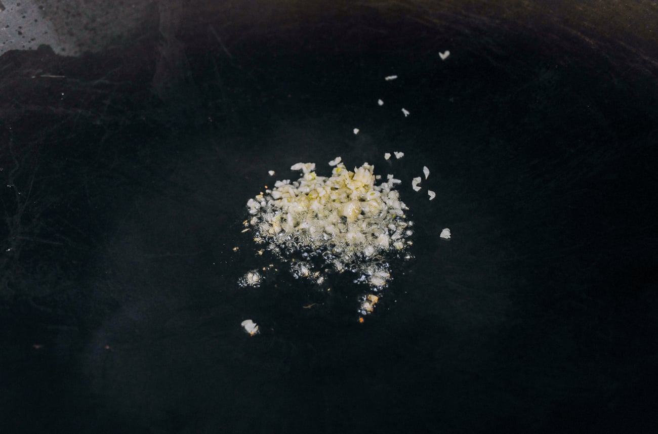 cooking chopped garlic in oil