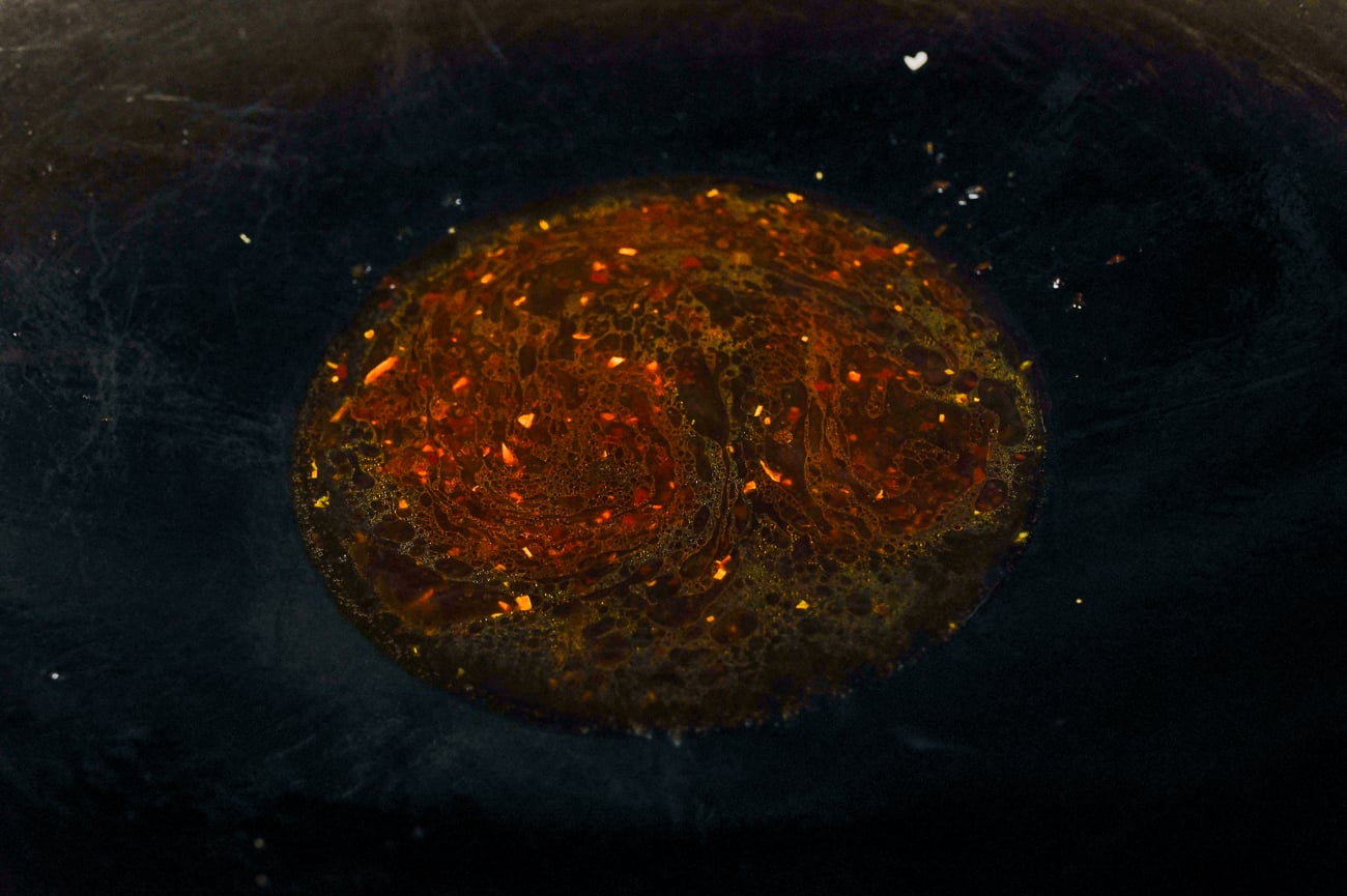 sauce mixture added to wok