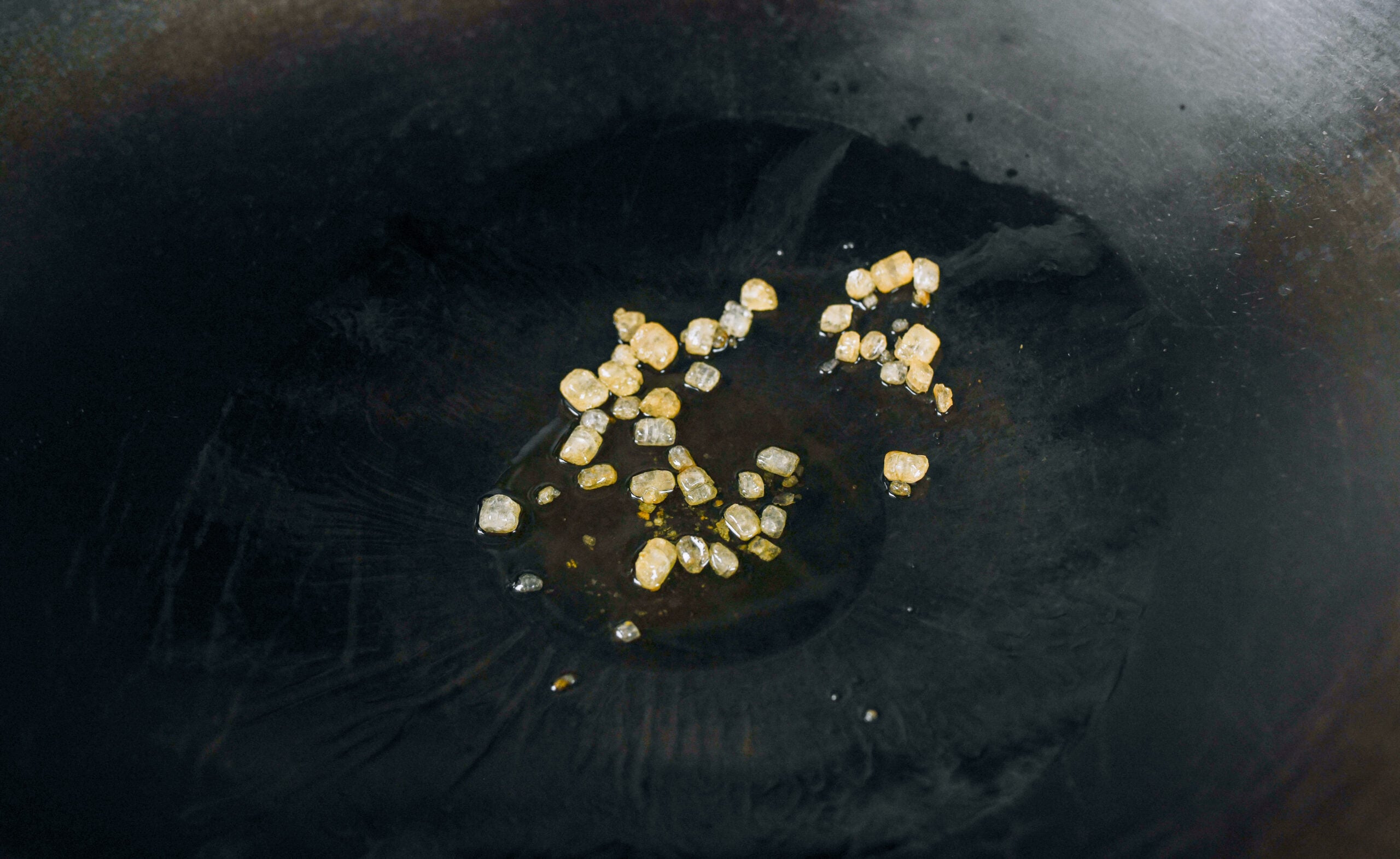 rock sugar in wok with oil