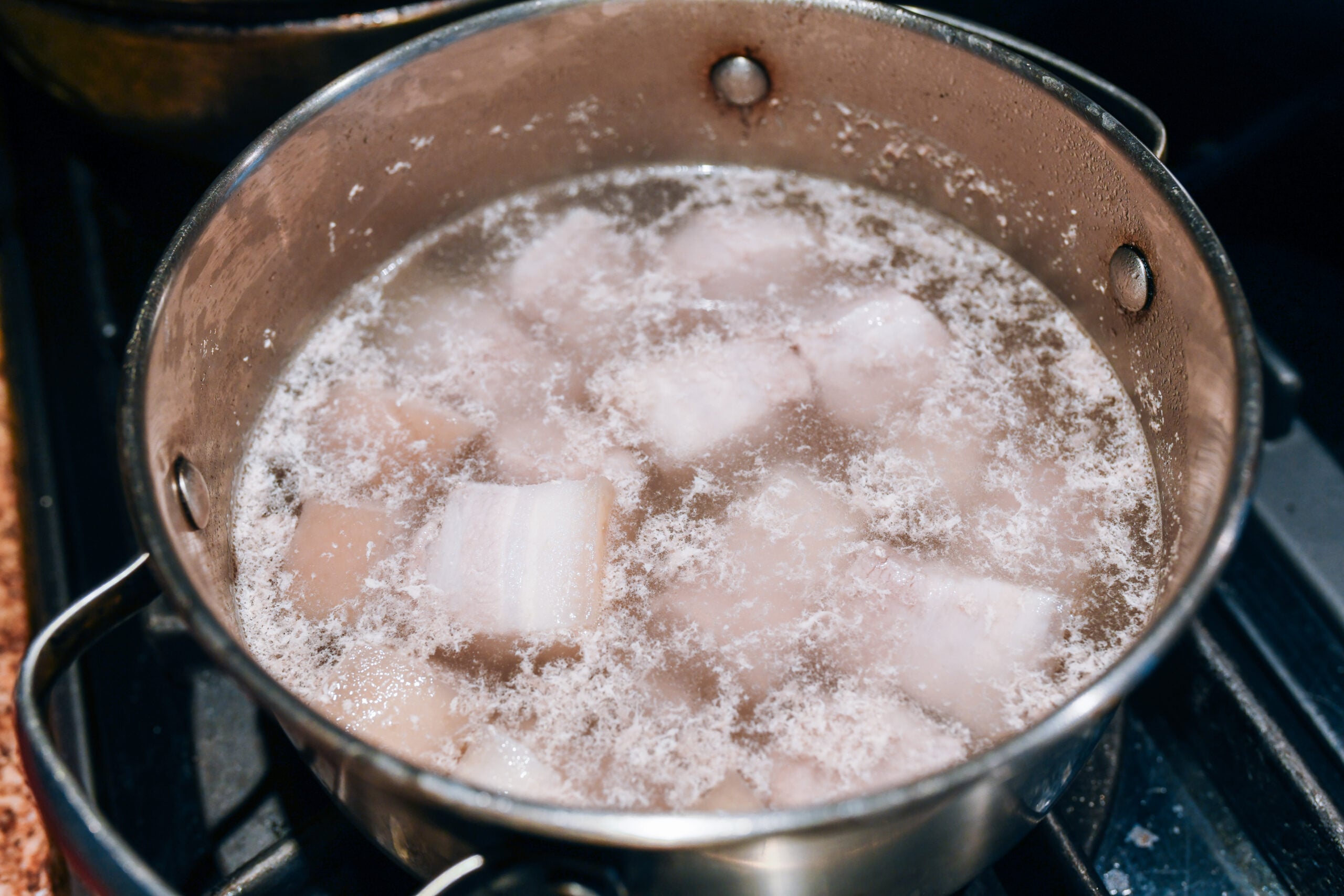 blanching pork belly in pot