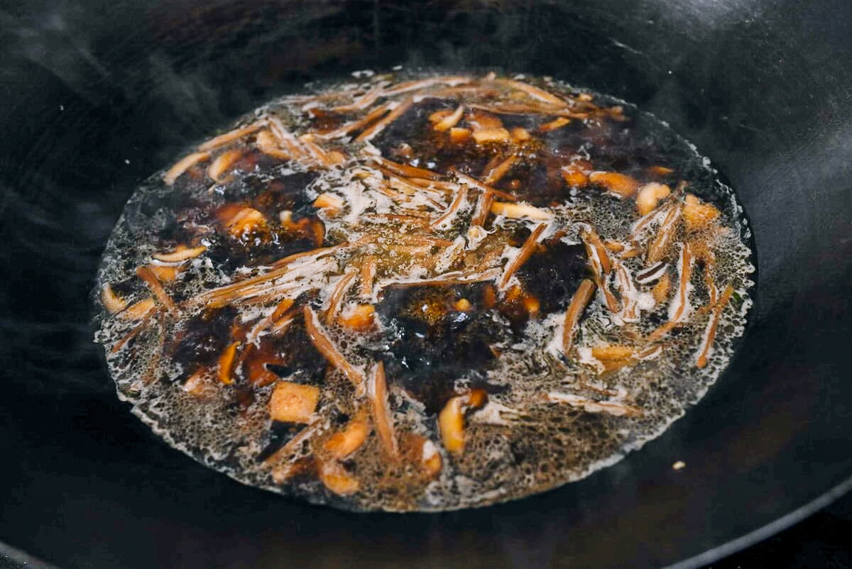 simmering stock with pork belly, mushrooms, wood ears, and lily flowers