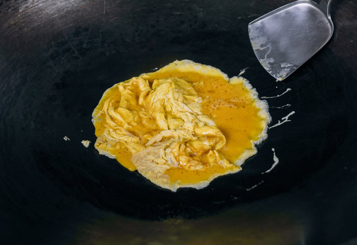 scrambling eggs in wok